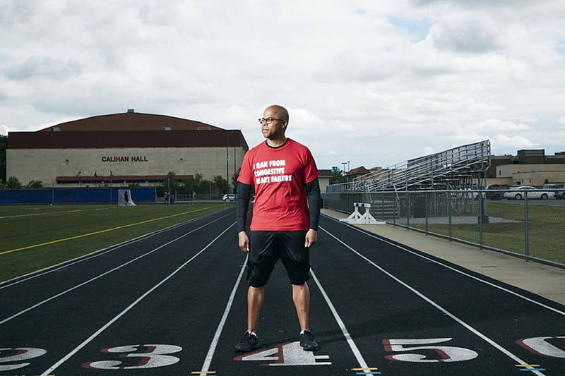 James Young II standing on the track at the University of Detroit Mercy in 2019