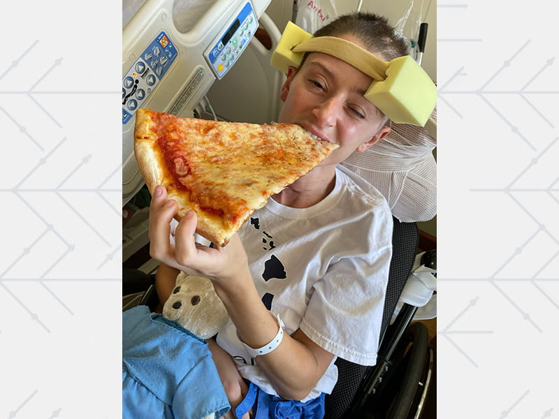 Jennifer was excited to nibble on a slice of pizza after doctors removed her trach tube